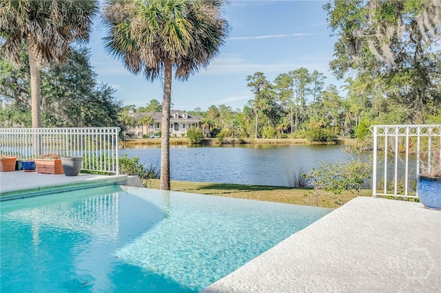 4 Longwater Ln, Savannah, GA 31411 - view of swimming pool with a water view, an infinity pool, and a patio