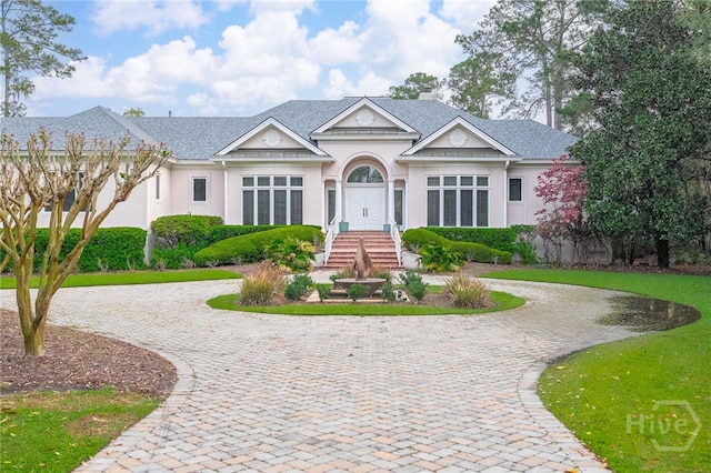 4 Longwater Ln, Savannah, GA 31411 - view of front of property featuring curved driveway and stucco siding