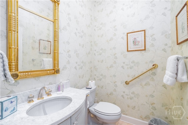 4 Longwater Ln, Savannah, GA 31411 - bathroom with toilet, vanity, and wallpapered walls