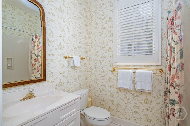 4 Longwater Ln, Savannah, GA 31411 - full bathroom with wallpapered walls, toilet, and vanity