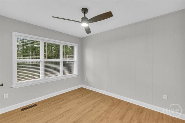 131 Pointe S Dr, Hinesville, GA 31313 - spare room featuring light wood finished floors, a ceiling fan, and baseboards