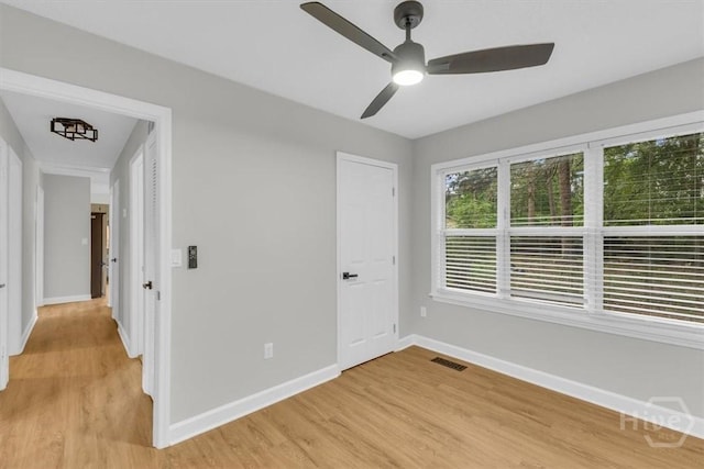 131 Pointe S Dr, Hinesville, GA 31313 - unfurnished bedroom featuring light wood-type flooring, baseboards, and ceiling fan