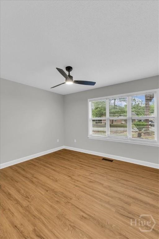 131 Pointe S Dr, Hinesville, GA 31313 - spare room with baseboards, ceiling fan, and light wood-style floors