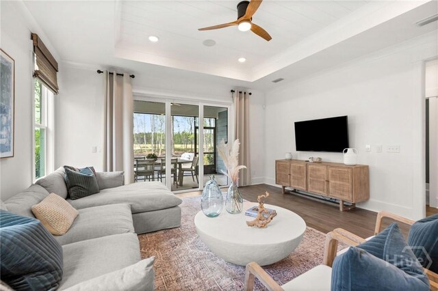 333 Birch Dr, Richmond Hill, GA 31324 - living room with healthy amount of natural light, a ceiling fan, wood finished floors, recessed lighting, and a raised ceiling