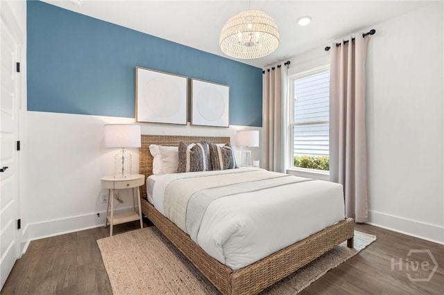 333 Birch Dr, Richmond Hill, GA 31324 - bedroom featuring baseboards, a chandelier, and dark wood-style floors