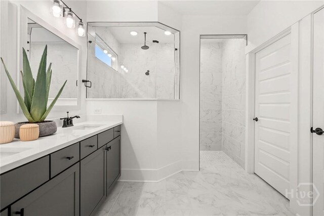 333 Birch Dr, Richmond Hill, GA 31324 - bathroom featuring marble finish floors, walk in shower, baseboards, and double vanity