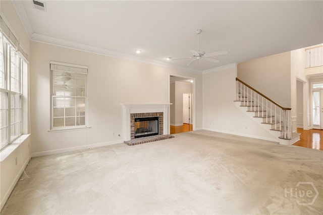 205 Meadowlark Cir, Savannah, GA 31419 - unfurnished living room with a ceiling fan, carpet floors, ornamental molding, stairs, and a fireplace