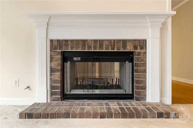 205 Meadowlark Cir, Savannah, GA 31419 - detailed view of a brick fireplace, baseboards, and crown molding