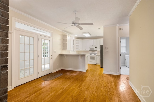 205 Meadowlark Cir, Savannah, GA 31419 - kitchen with white appliances, open shelves, a peninsula, crown molding, and white cabinets