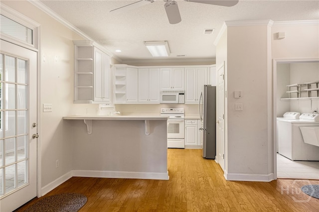 205 Meadowlark Cir, Savannah, GA 31419 - kitchen featuring white appliances, open shelves, a ceiling fan, a peninsula, and light wood-type flooring