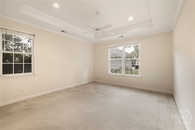 205 Meadowlark Cir, Savannah, GA 31419 - carpeted empty room featuring a tray ceiling, healthy amount of natural light, ornamental molding, a ceiling fan, and baseboards
