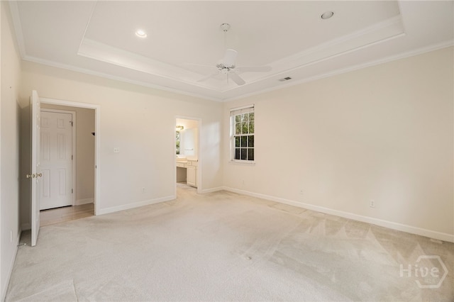 205 Meadowlark Cir, Savannah, GA 31419 - spare room featuring a tray ceiling, light carpet, a ceiling fan, ornamental molding, and baseboards