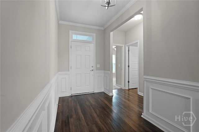 2 Chimney Ct, Savannah, GA 31407 - foyer entrance featuring dark wood-style flooring, crown molding, a wainscoted wall, and a decorative wall