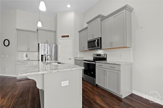 2 Chimney Ct, Savannah, GA 31407 - kitchen with appliances with stainless steel finishes, a sink, gray cabinetry, and light stone countertops