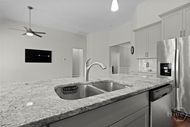 2 Chimney Ct, Savannah, GA 31407 - kitchen with appliances with stainless steel finishes, a sink, light stone countertops, and a ceiling fan