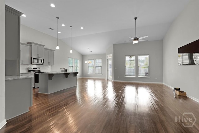 2 Chimney Ct, Savannah, GA 31407 - unfurnished living room featuring dark wood-style floors, ceiling fan, baseboards, recessed lighting, and high vaulted ceiling