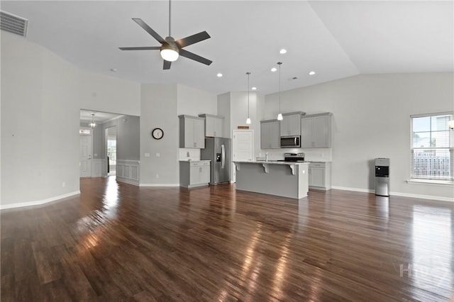 2 Chimney Ct, Savannah, GA 31407 - unfurnished living room with high vaulted ceiling, dark wood-type flooring, a ceiling fan, baseboards, and recessed lighting