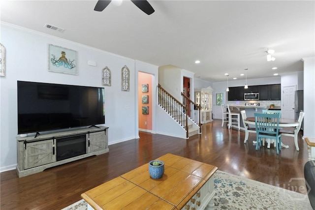 402 Southwilde Way, Pooler, GA 31322 - living area featuring ceiling fan, stairway, dark wood finished floors, baseboards, and ornamental molding