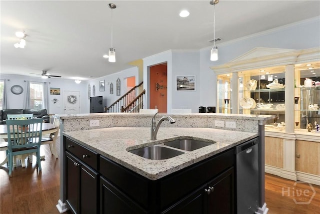 402 Southwilde Way, Pooler, GA 31322 - kitchen with dishwasher, a sink, open floor plan, dark cabinetry, and dark wood finished floors