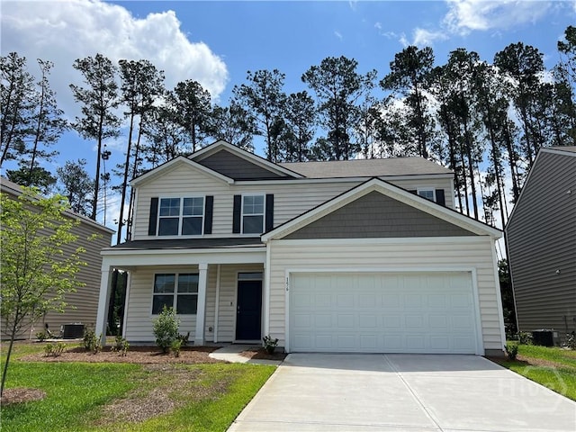 156 Kraft, Pooler, GA 31322 - view of front of house with driveway, an attached garage, and a porch