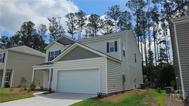 156 Kraft, Pooler, GA 31322 - view of front facade with driveway, cooling unit, and a garage