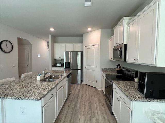 156 Kraft, Pooler, GA 31322 - kitchen with appliances with stainless steel finishes, a sink, light wood-type flooring, white cabinets, and recessed lighting