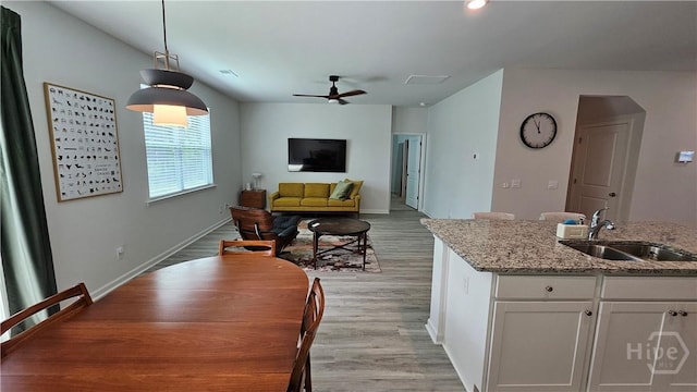 156 Kraft, Pooler, GA 31322 - dining area featuring ceiling fan, light wood-style floors, and baseboards