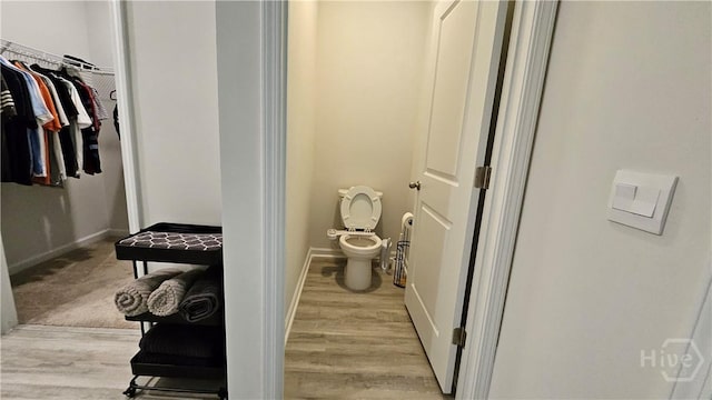 156 Kraft, Pooler, GA 31322 - bathroom with toilet, wood finished floors, baseboards, and a walk in closet
