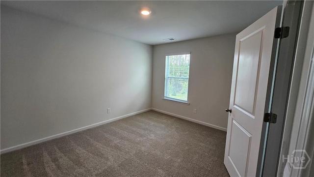 156 Kraft, Pooler, GA 31322 - empty room with dark carpet and baseboards