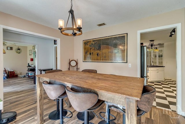 510 Mallory Rd, Reidsville, GA 30453 - dining room featuring a chandelier and light wood-style flooring