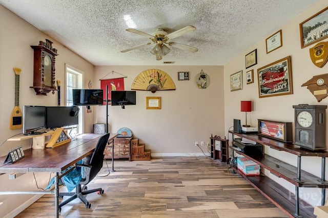 510 Mallory Rd, Reidsville, GA 30453 - office with ceiling fan, wood finished floors, a textured ceiling, and baseboards