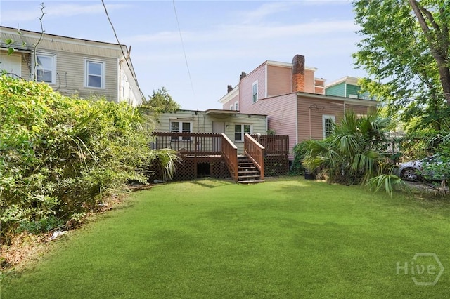 514 W 38th St, Savannah, GA 31415 - back of house with a yard, a wooden deck, and a chimney