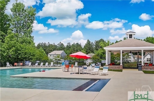 124 Tobago Cir, Guyton, GA 31312 - community pool featuring a gazebo and a patio