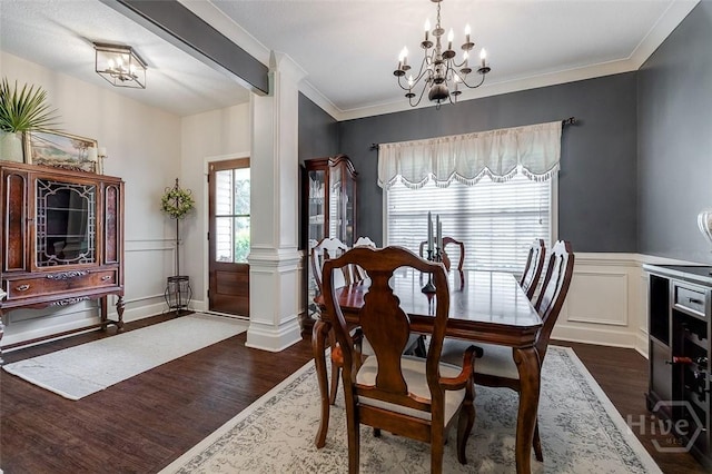 109 Oaklawn Dr, Rincon, GA 31326 - dining room with dark wood-style floors, a chandelier, decorative columns, a wainscoted wall, and ornamental molding