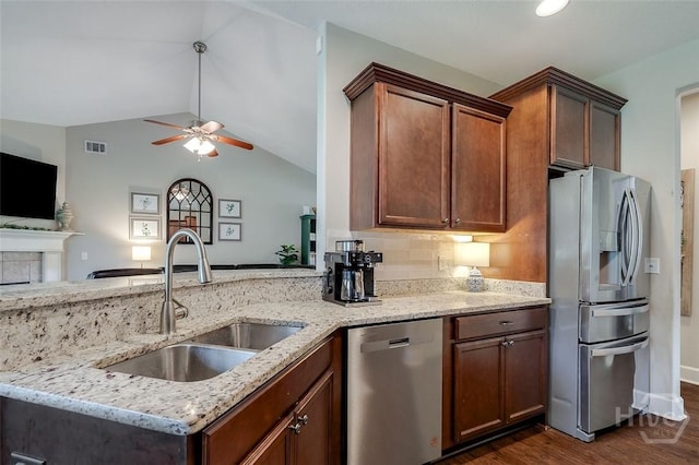 109 Oaklawn Dr, Rincon, GA 31326 - kitchen with appliances with stainless steel finishes, a sink, ceiling fan, light stone counters, and dark wood-style flooring