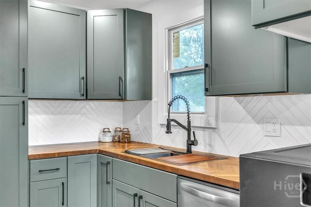 2501 Louisiana Ave, Savannah, GA 31404 - kitchen featuring butcher block countertops, stainless steel dishwasher, decorative backsplash, and a sink