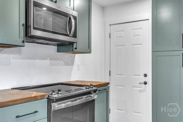 2501 Louisiana Ave, Savannah, GA 31404 - kitchen featuring stainless steel appliances, wooden counters, and backsplash