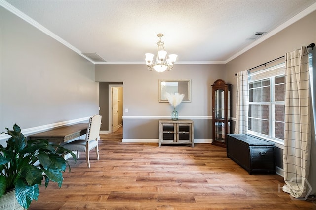 209 Saint James Walk, Guyton, GA 31312 - dining space featuring a chandelier, wood finished floors, ornamental molding, and baseboards
