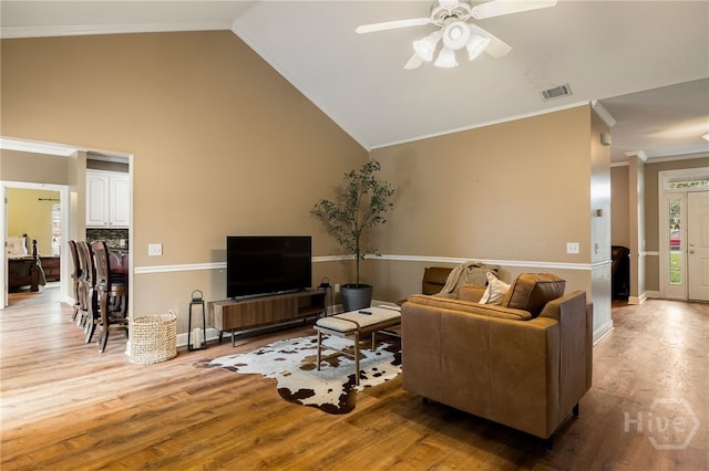 209 Saint James Walk, Guyton, GA 31312 - living area featuring ceiling fan, wood finished floors, lofted ceiling, crown molding, and baseboards