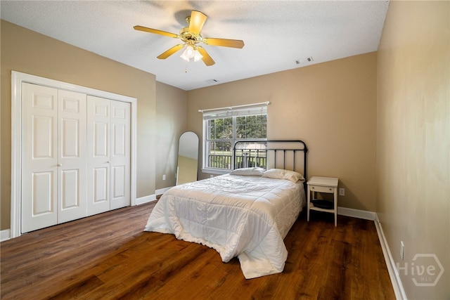 209 Saint James Walk, Guyton, GA 31312 - bedroom with wood finished floors, baseboards, a closet, and ceiling fan