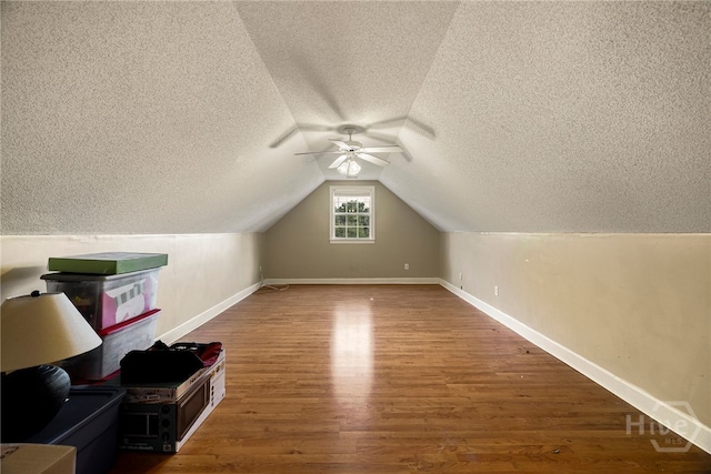 209 Saint James Walk, Guyton, GA 31312 - additional living space featuring ceiling fan, a textured ceiling, wood finished floors, baseboards, and vaulted ceiling