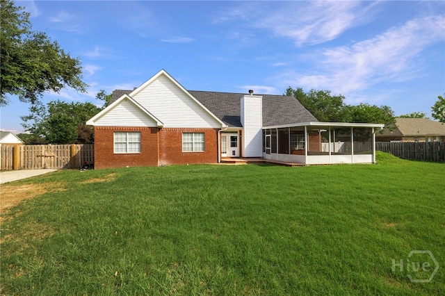 209 Saint James Walk, Guyton, GA 31312 - back of property featuring a sunroom, a chimney, and brick siding