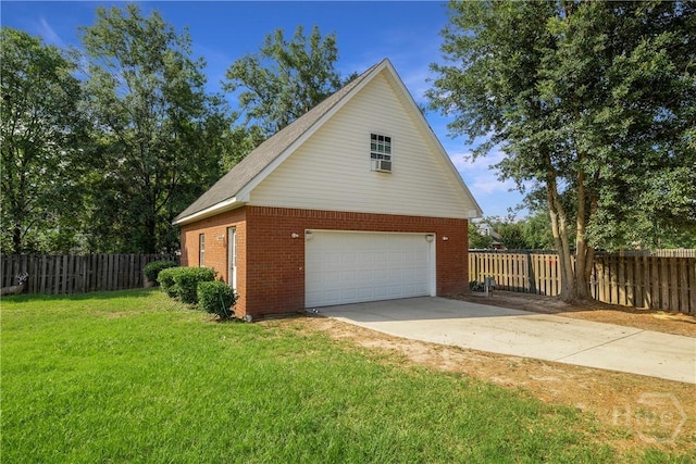 209 Saint James Walk, Guyton, GA 31312 - view of home's exterior featuring brick siding, an outbuilding, and a detached garage