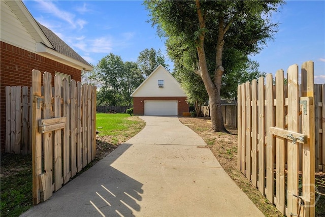 209 Saint James Walk, Guyton, GA 31312 - view of yard featuring a detached garage and an outdoor structure