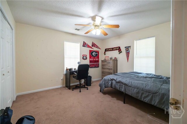 812 King Arthur Dr, Statesboro, GA 30458 - carpeted bedroom featuring an office area, ceiling fan, a closet, and baseboards