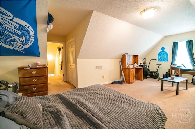 812 King Arthur Dr, Statesboro, GA 30458 - bedroom featuring carpet floors, lofted ceiling, a textured ceiling, and baseboards