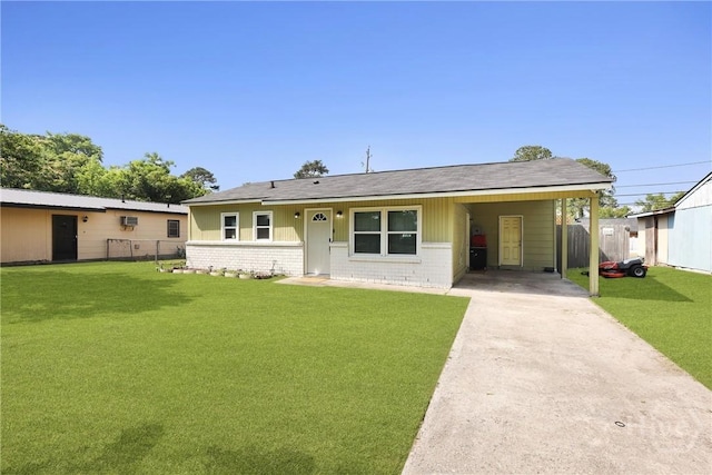 1504 Audubon Dr, Savannah, GA 31415 - ranch-style home featuring concrete driveway, an attached carport, a shingled roof, and brick siding