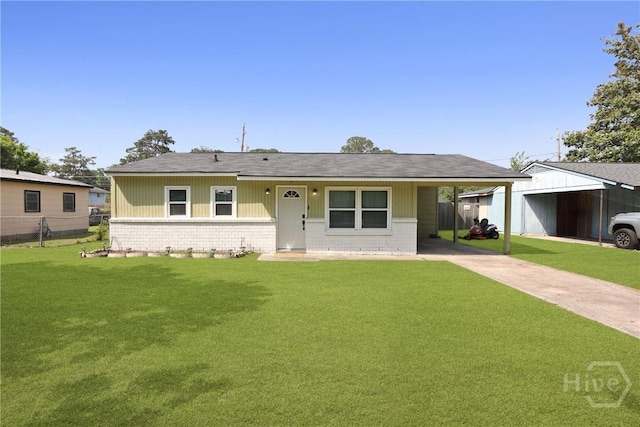 1504 Audubon Dr, Savannah, GA 31415 - view of front of home featuring an attached carport, concrete driveway, brick siding, and roof with shingles