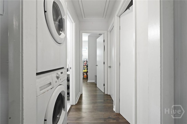 1504 Audubon Dr, Savannah, GA 31415 - washroom with stacked washer and clothes dryer, attic access, dark wood-style floors, and baseboards