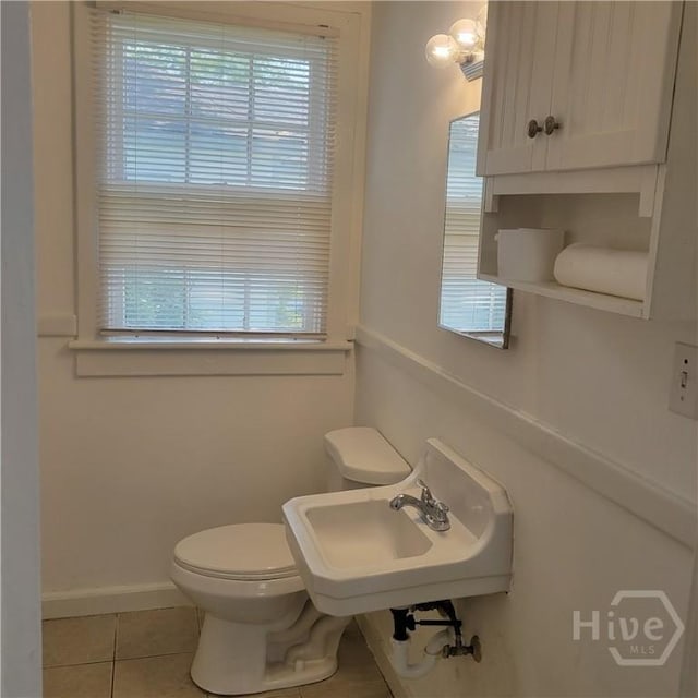 1214 Delesseps Ave, Savannah, GA 31404 - half bath with tile patterned floors, healthy amount of natural light, and toilet